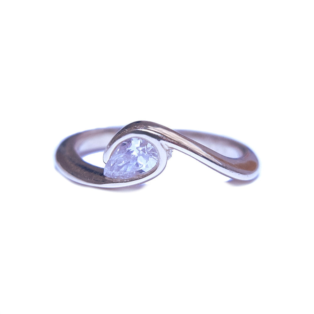 golden wave engagement ring design with set diamond