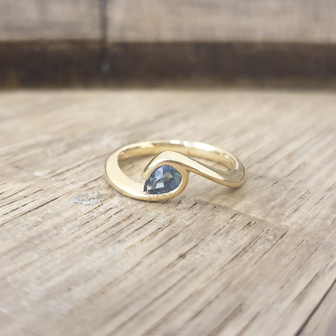 Teal sapphire wave ring